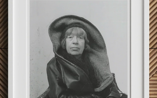 Black and white portrait of a person in large dark hood inspired by louise bourgeois and marina abramović rituals