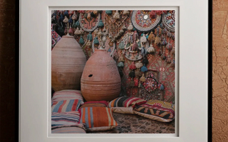 Terracotta egg-shaped pot with small hole near top showcasing handcrafted decorations and personal touch through human intervention