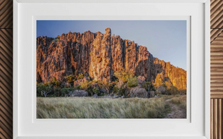 Rugged orange-hued rock formation with steep cliffs and jagged peaks featured in windjana gorge performance for theatre studies