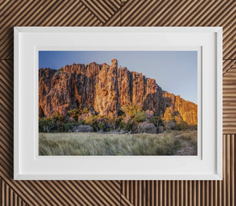 Rugged orange-hued rock formation with steep cliffs and jagged peaks featured in windjana gorge performance for theatre studies