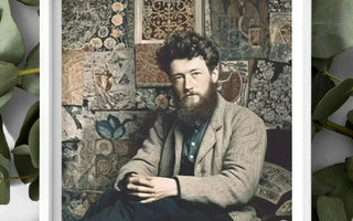 Man with a full beard wearing a gray suit jacket against a patterned backdrop in pre-raphaelite brotherhood article