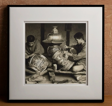 Artisans crafting ornate metal lanterns highlighting traditional japanese craftsmanship and meticulous attention to detail