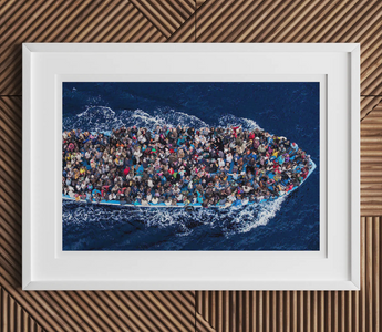 Overcrowded boat with asylum seekers wearing colorful clothing illustrating staging asylum and digital extension themes