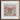 Colorful butterfly artwork composed of various small objects arranged symmetrically.