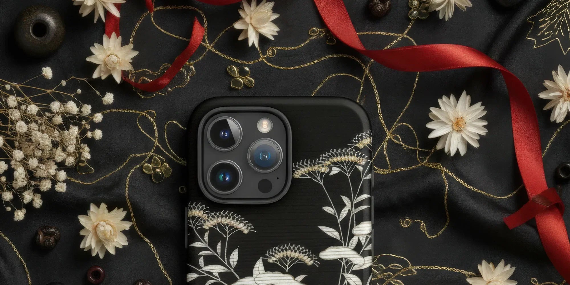 IPhone with a decorative floral pattern case.
