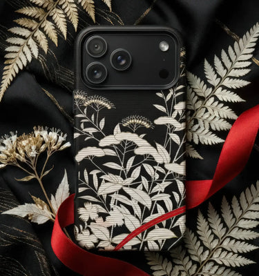 Black and White Phone Cases featuring floral designs on a black background with decorative elements.