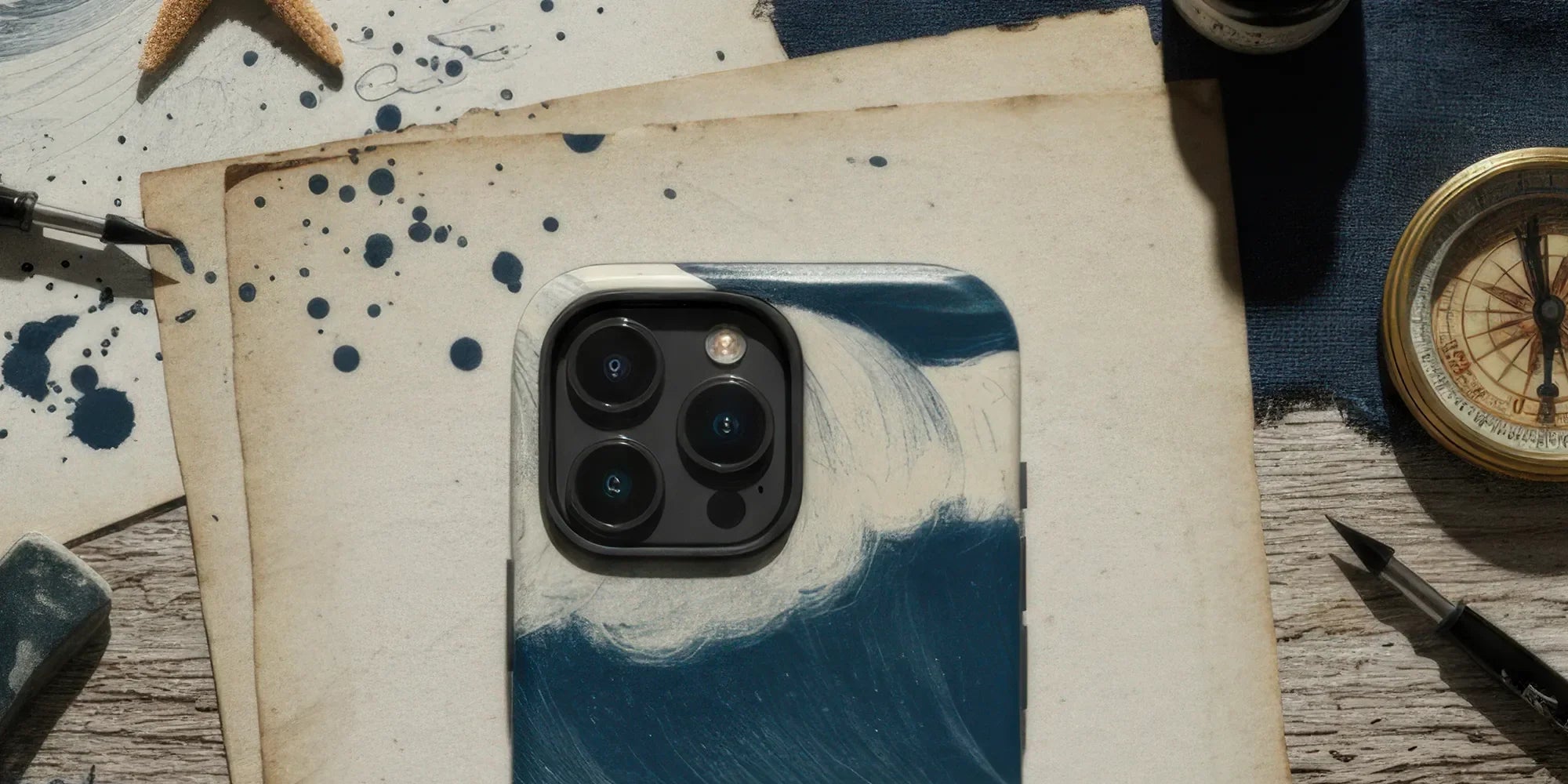 IPhone with a blue and white floral patterned case.