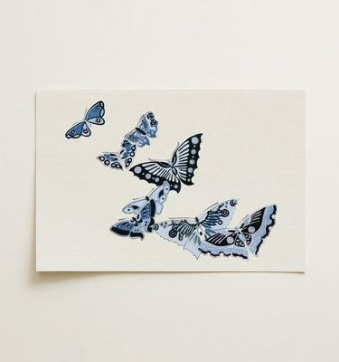 Blue Wall Art featuring intricately designed butterflies in various shades of blue on a white background.