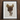 Framed artwork depicting a vintage leather horse saddle with stirrups.