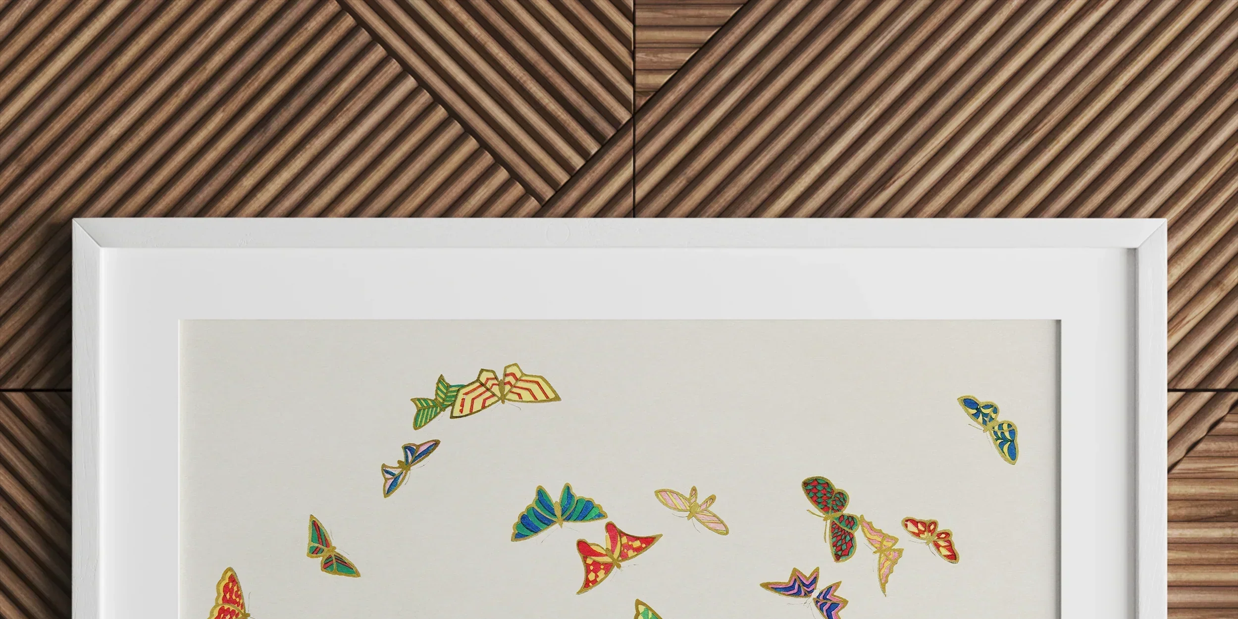 Framed artwork featuring colorful embroidered butterflies on a light background.
