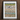 Framed abstract artwork featuring colorful, organic shapes and swirling patterns.