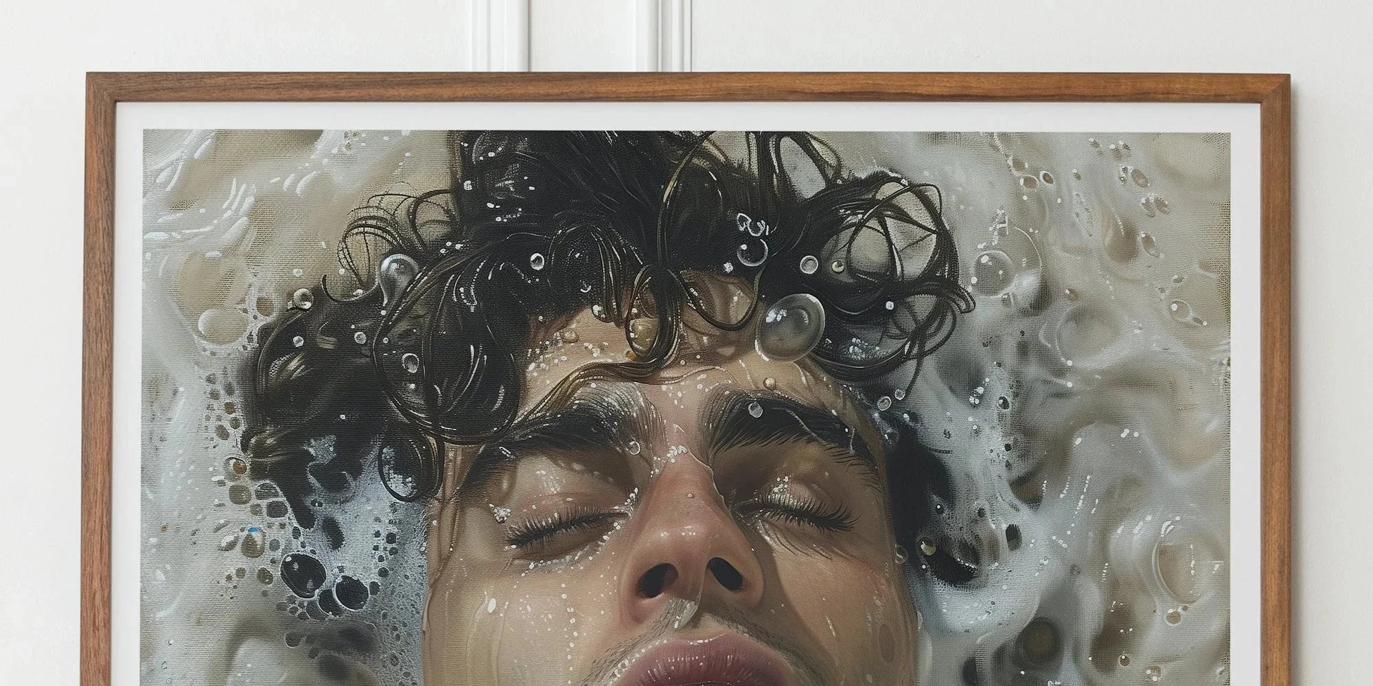 Framed photograph of a person submerged in water with bubbles and curly hair.