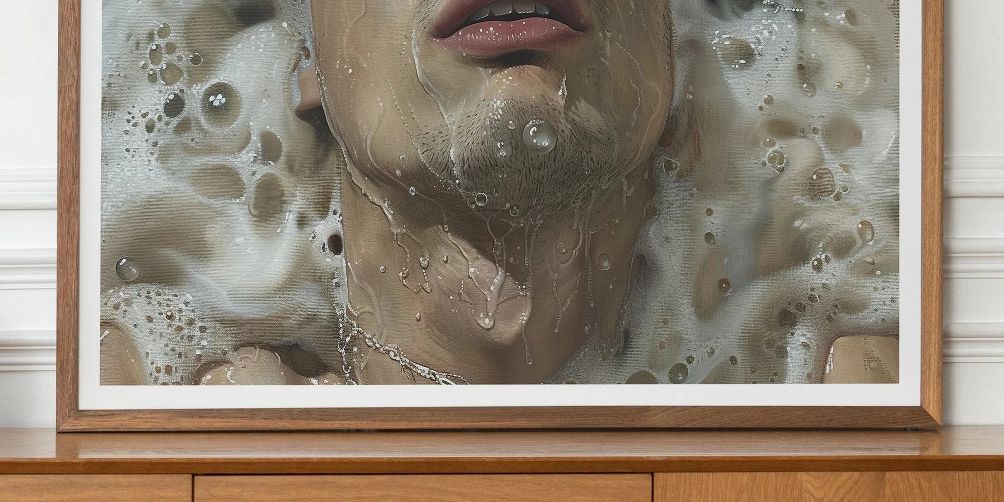Framed photograph of a person submerged in water with bubbles and curly hair.
