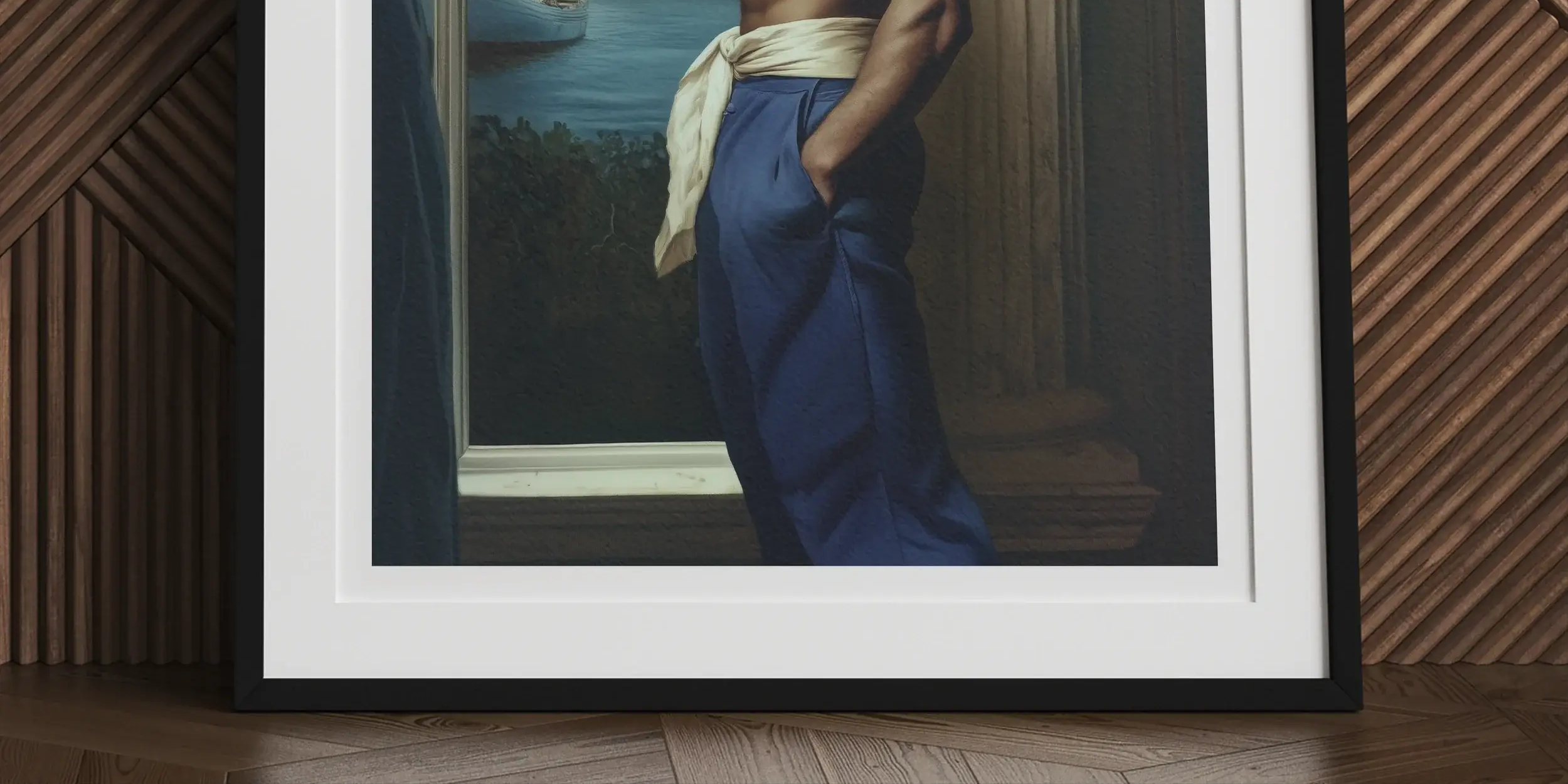Framed photograph of a shirtless, muscular man wearing a headband and blue pants, standing by a window.