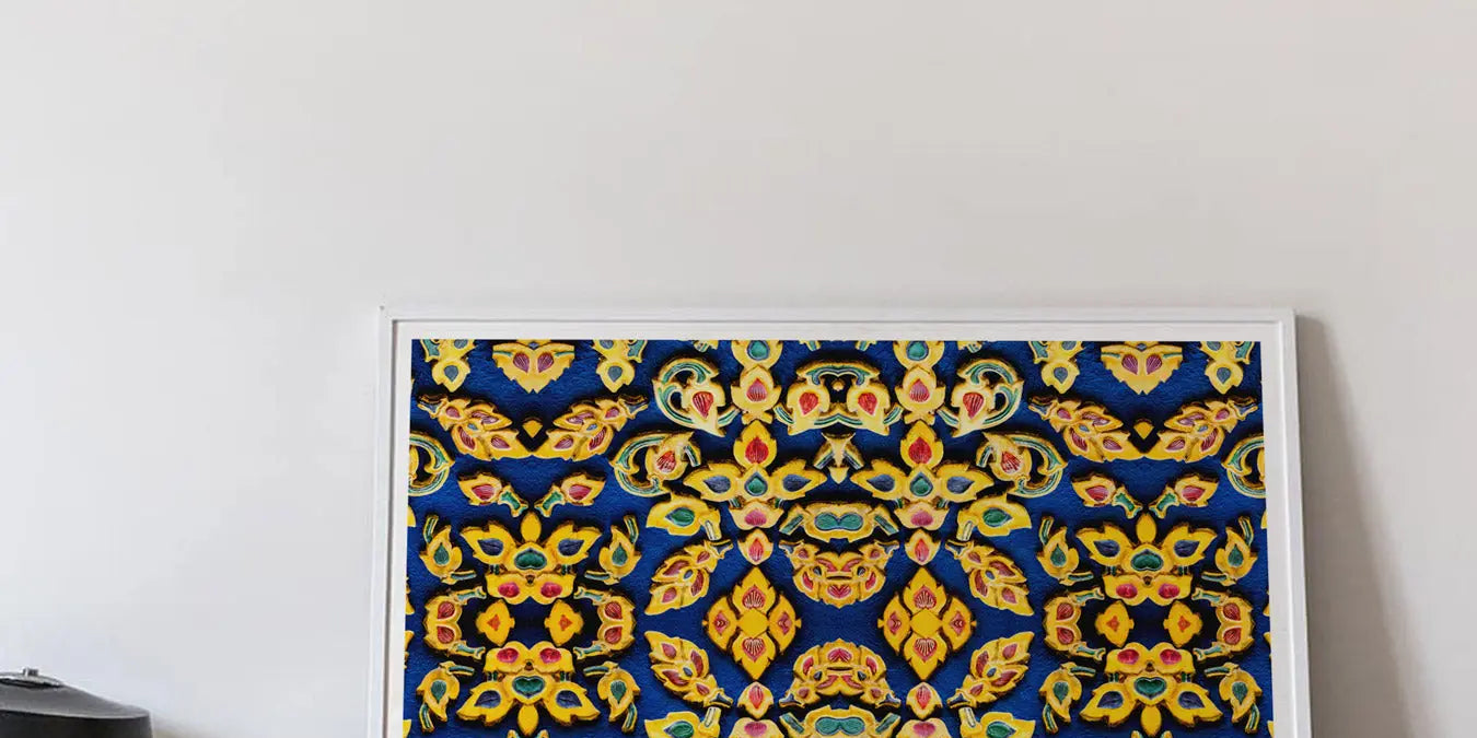 Framed colorful geometric pattern artwork with intricate floral and arabesque designs in blue, gold, and orange.