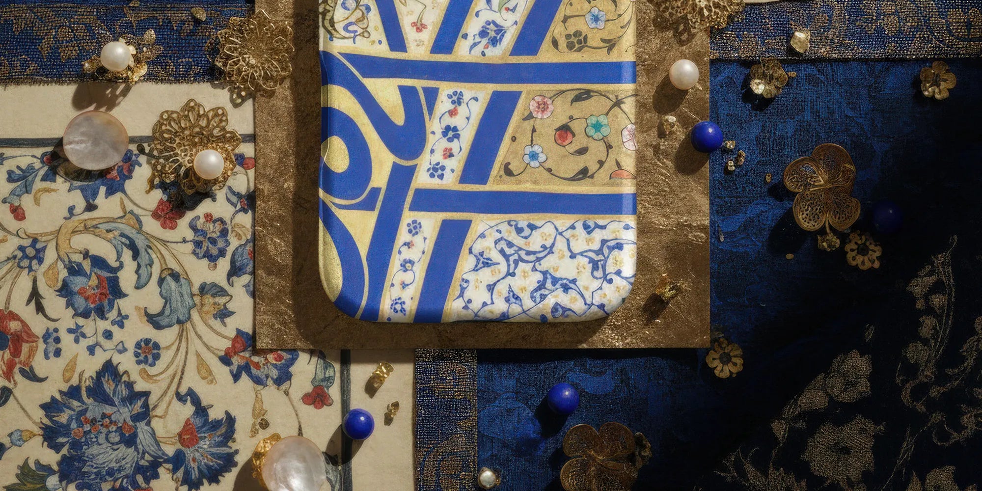 Smartphone with a decorative mandala-patterned case.