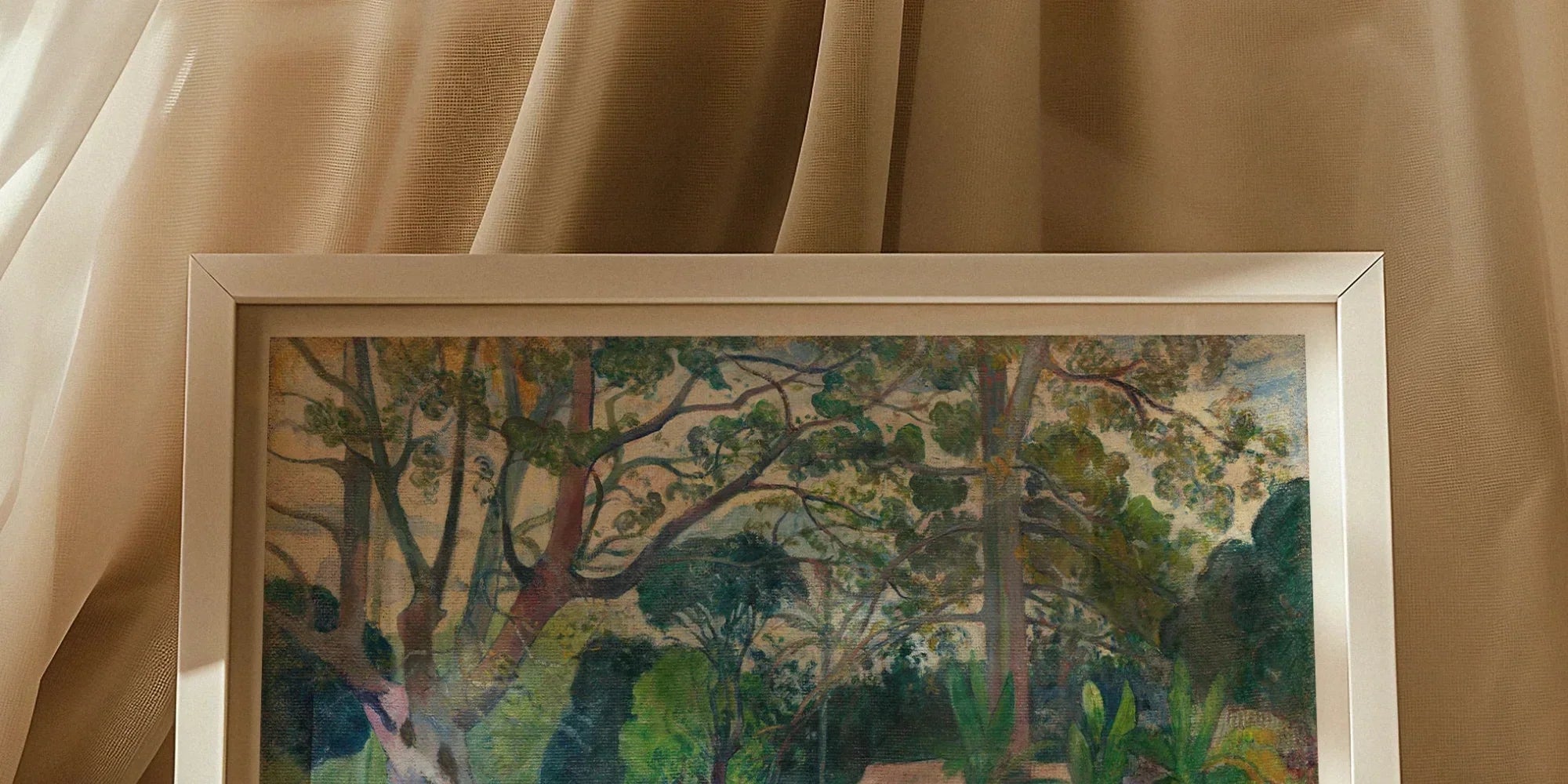 Framed painting depicting a lush tropical landscape with figures in a garden-like setting.
