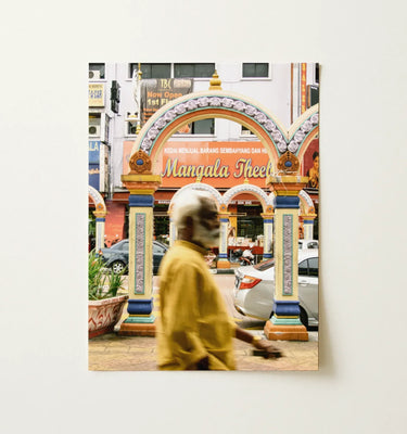Malaysian Wall Art featuring a colorful street scene in Kuala Lumpur with a man walking past an archway.