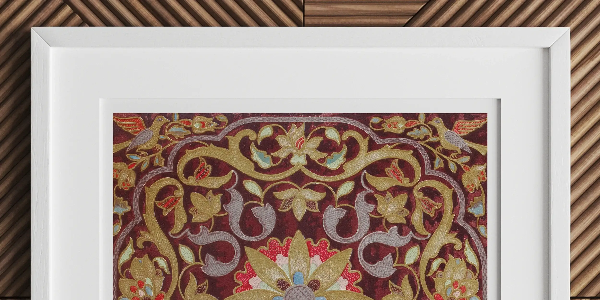 Ornate golden metalwork featuring intricate scrolls and a bearded face centerpiece against a blue background.