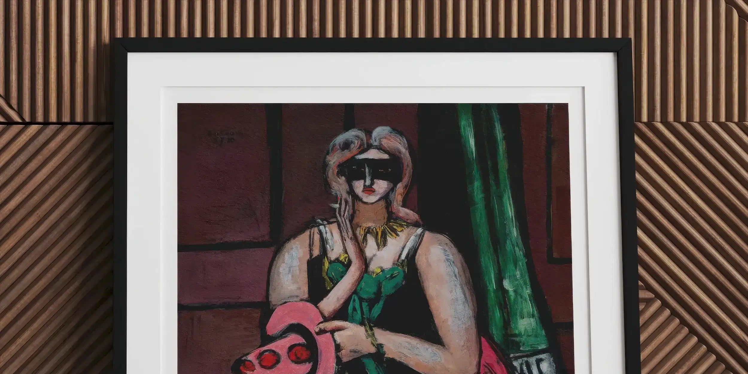 Framed photograph of a person wearing a raccoon-like mask and holding a pink guitar.