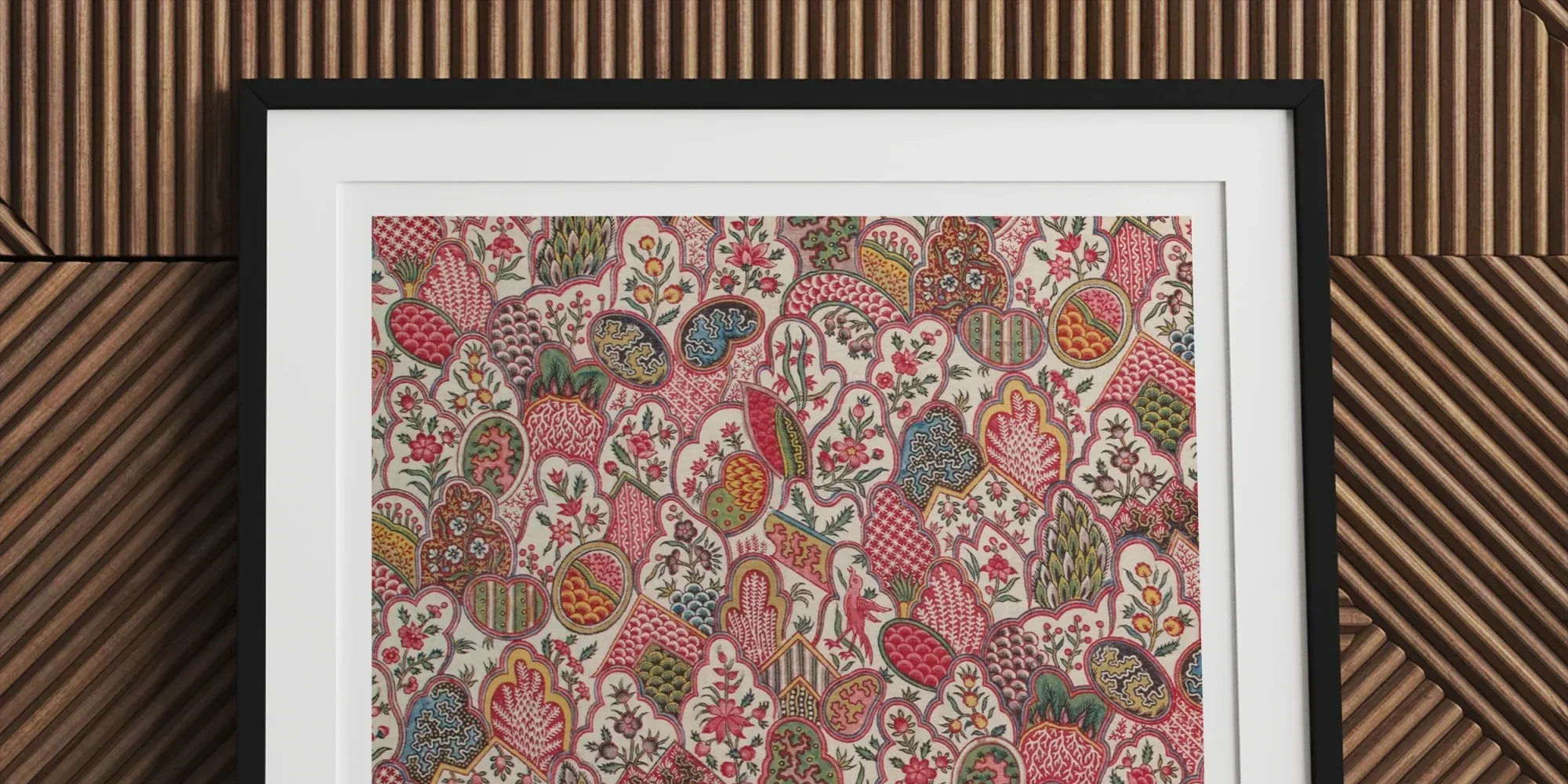 Framed floral and animal print artwork with colorful embroidered or painted designs on a light background.