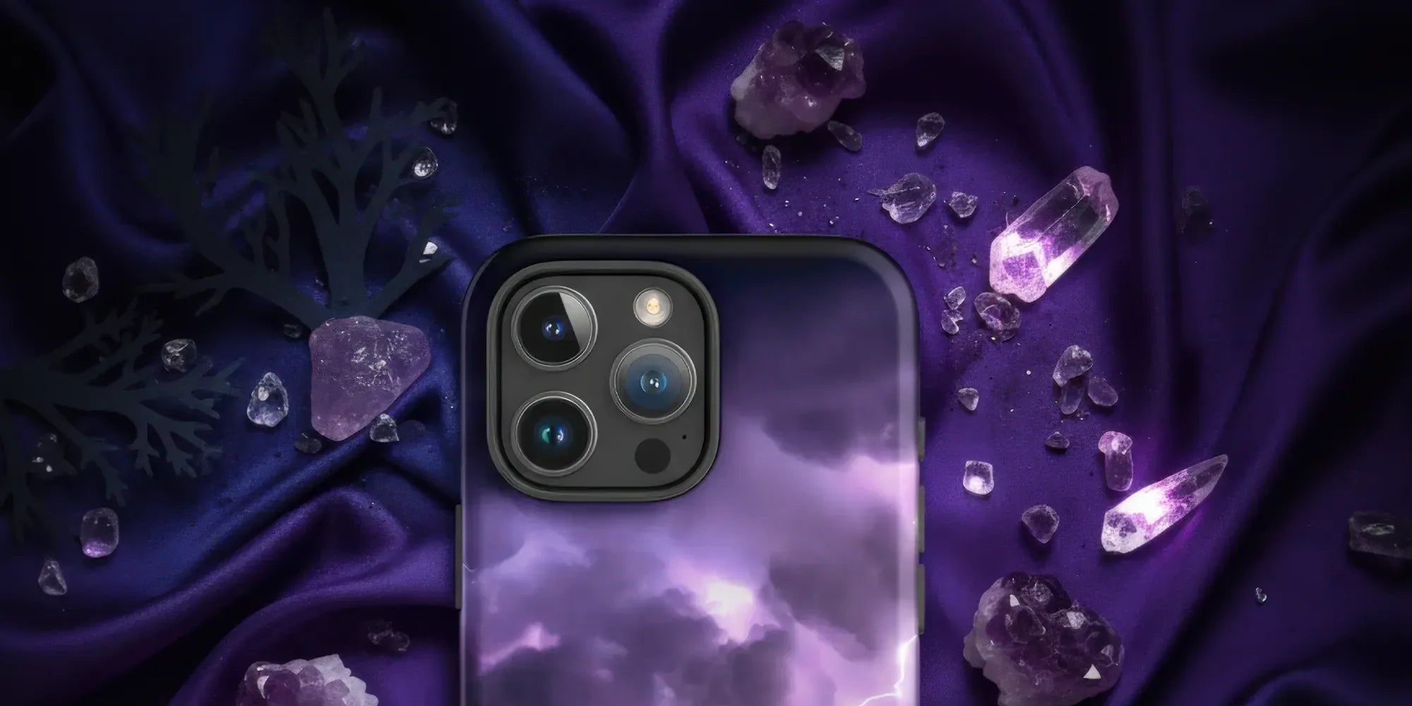 Purple iPhone case with an intricate white floral and vine pattern.