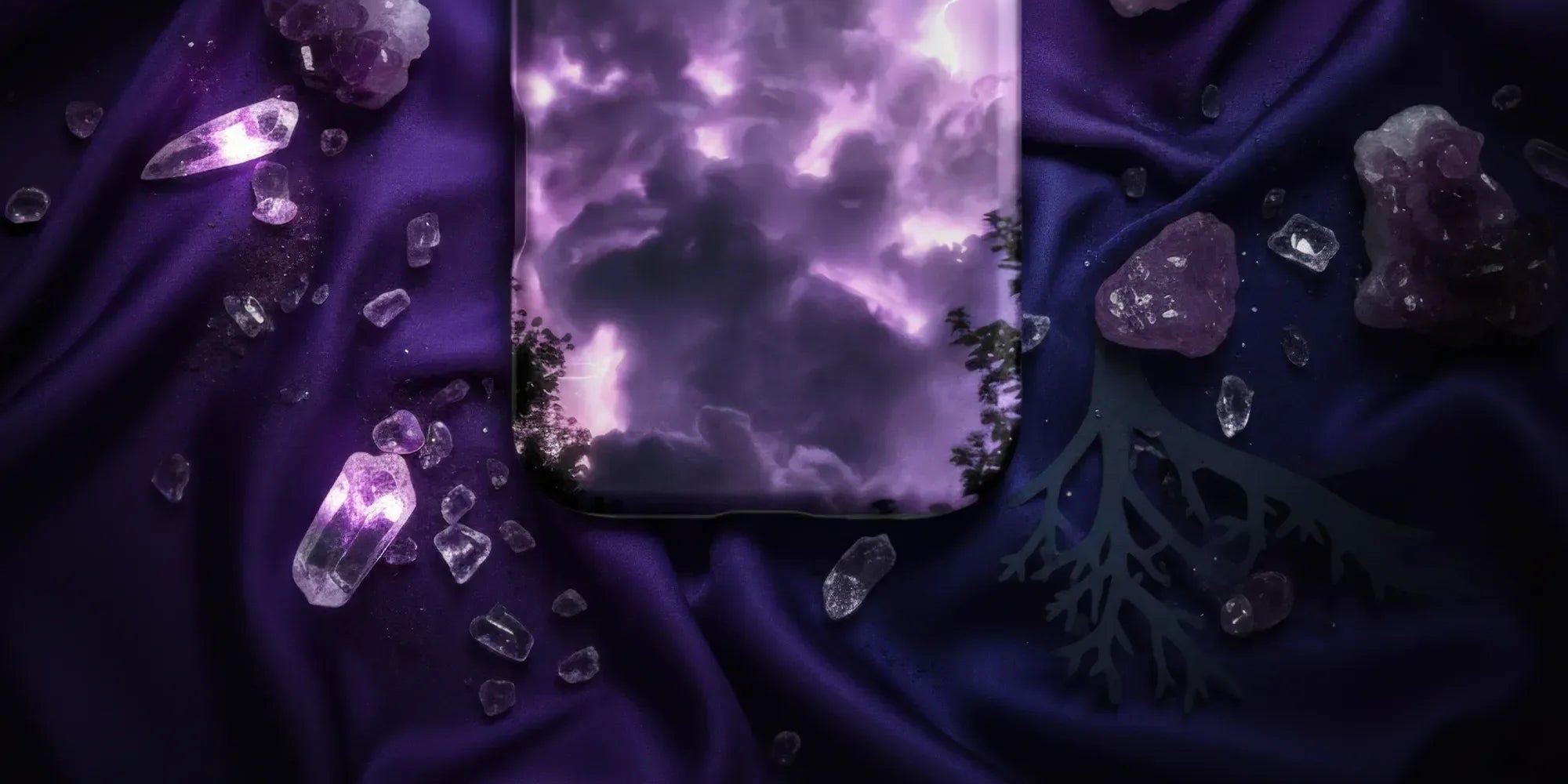 Purple iPhone case with an intricate white floral and vine pattern.