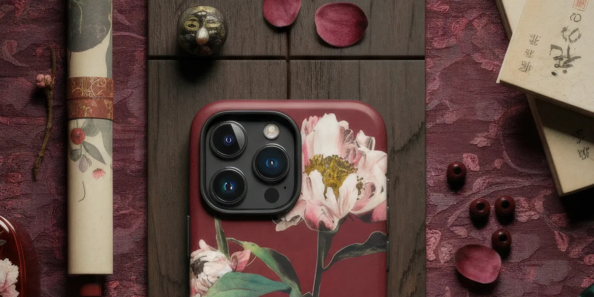 IPhone case featuring a floral design with pink chrysanthemums.