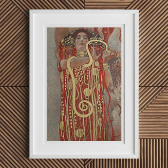 Framed artwork depicting a woman in an ornate gold and red dress with spiral patterns.