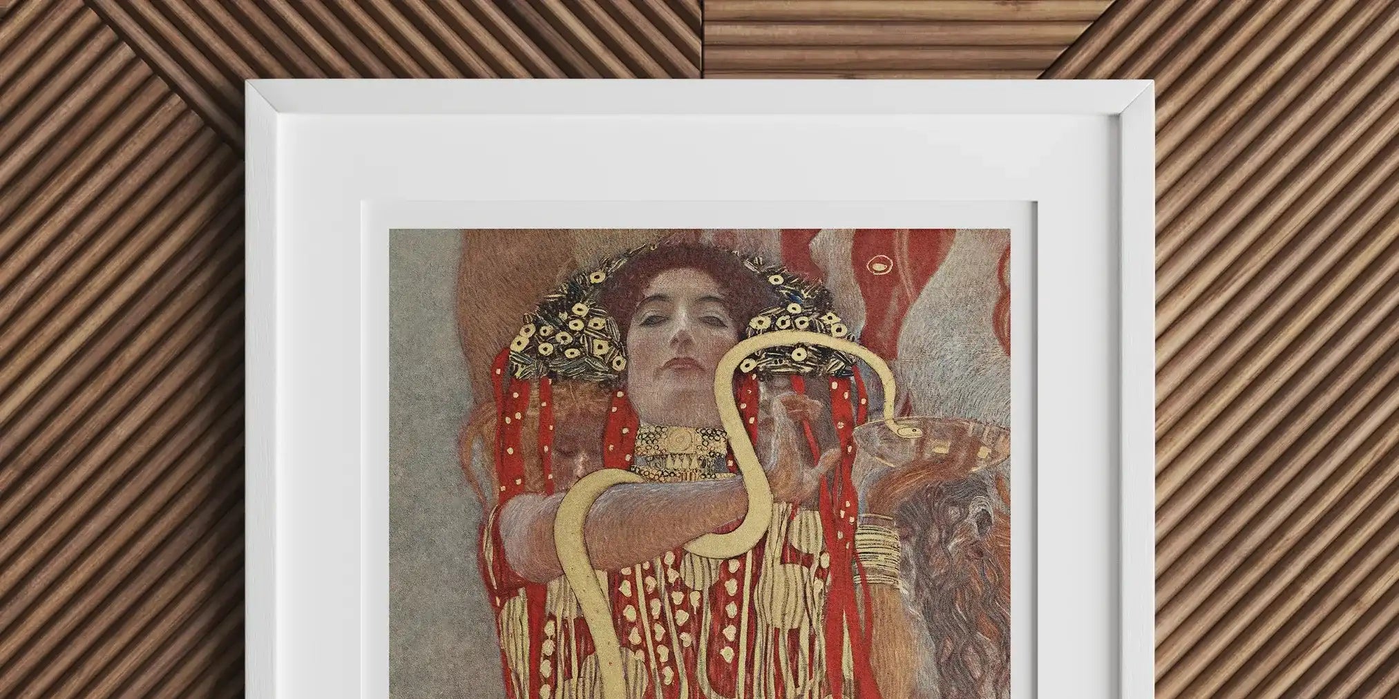 Framed artwork depicting a woman in an ornate gold and red dress with spiral patterns.