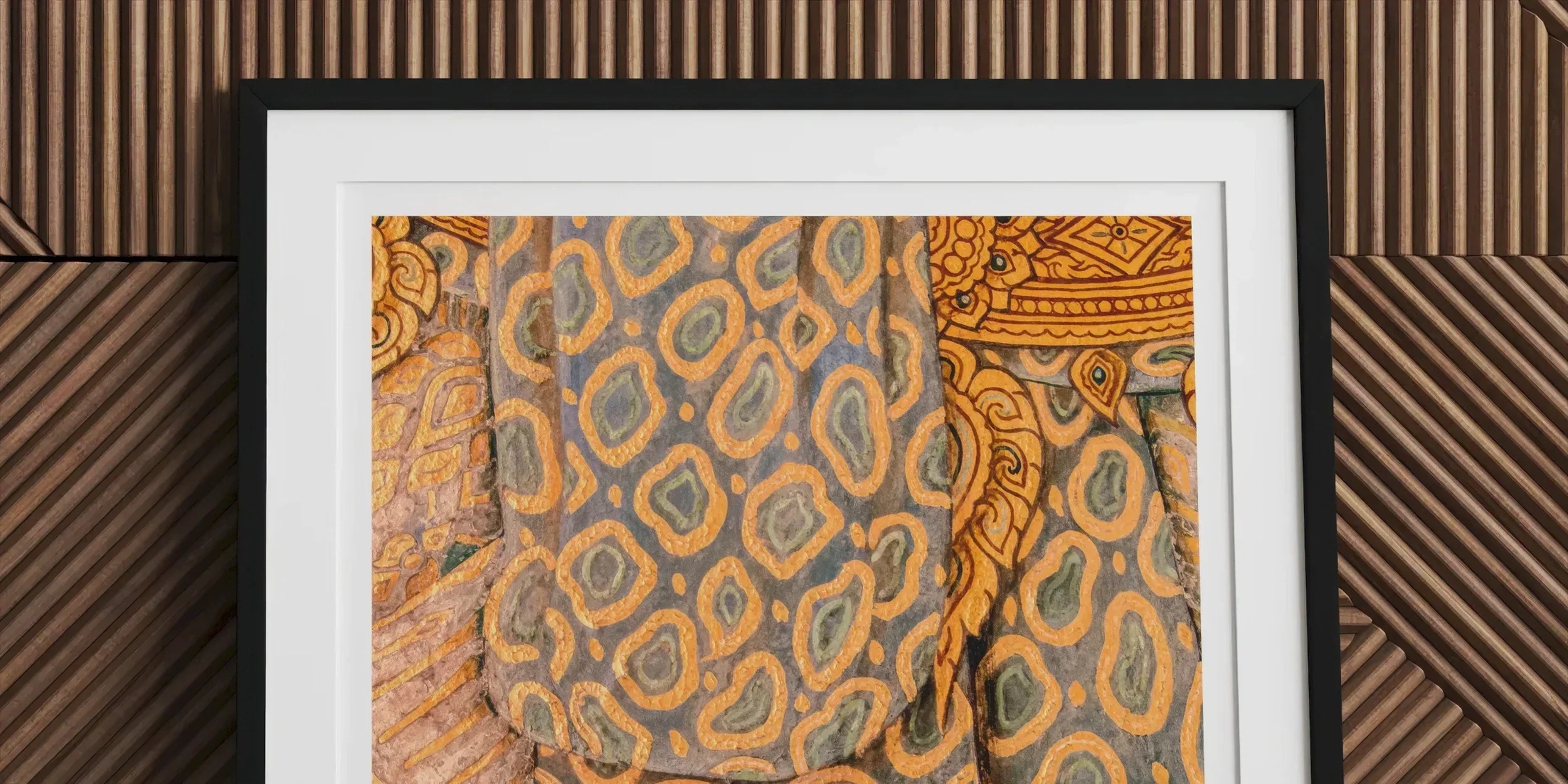 Framed artwork depicting colorful, patterned textiles with intricate designs.