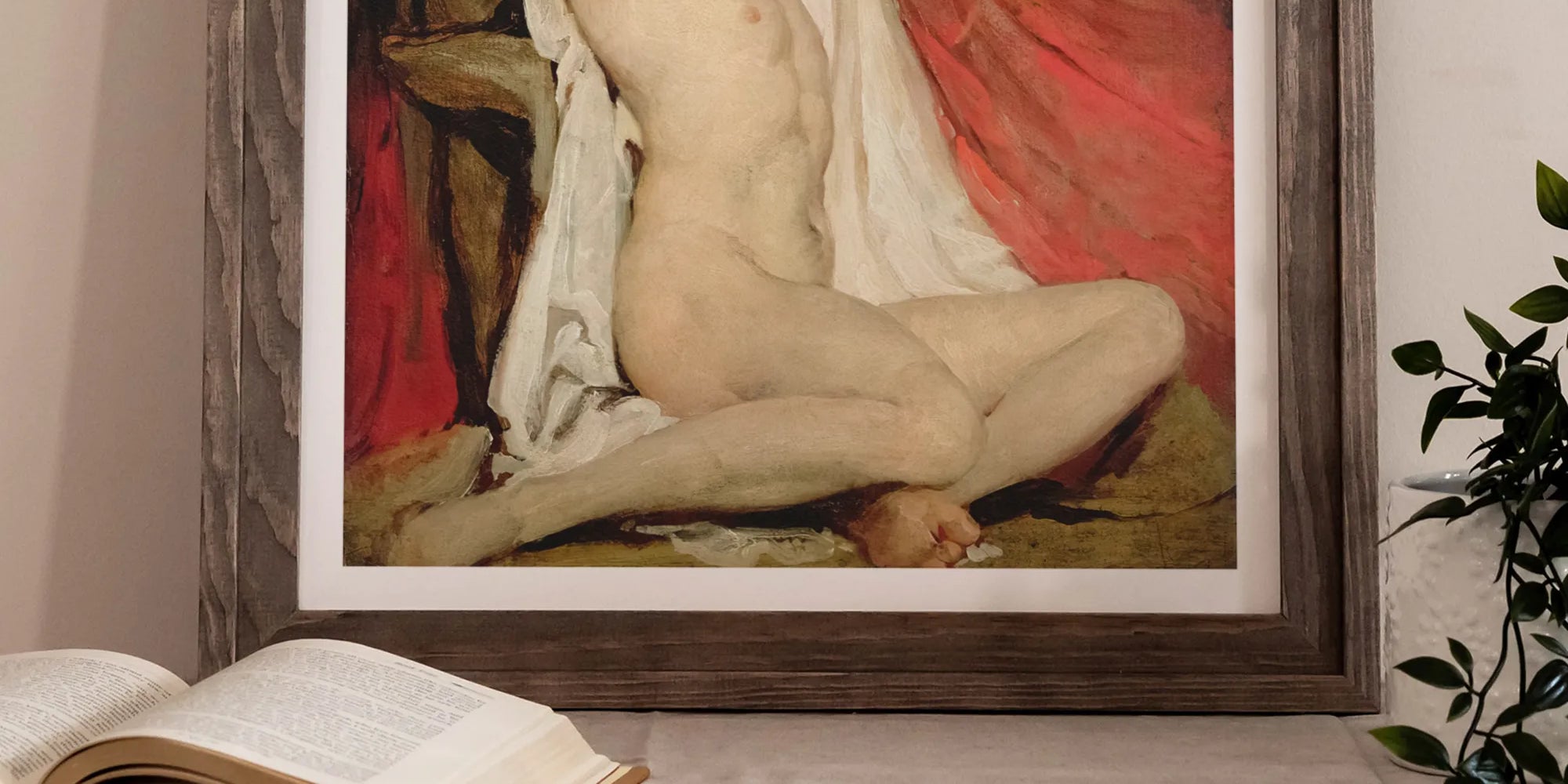 Framed painting of a nude figure with arms raised, seated against a red background.