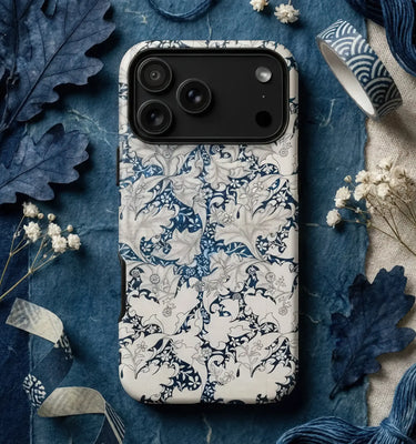 Decorative william morris iphone case featuring intricate blue floral and bird pattern inspired by 19th-century artistic rebellion
