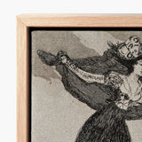 Framed Black-and-white Illustration Woman Ornate Dress Hat Enclosed Goya’s Vision Glides, Etching Unites Anatomy, Enlightenment Borne Aloft