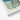 Vintage-style Teal Cream Floral-patterned Cylindrical Tin Blue Lid Decorative 1930s Decor, Art, Bygone Elegance