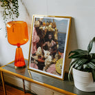 Douglas - Black Gay Pirate Art Print, Framed Photograph Alongside Orange Table Lamp Potted Plant
