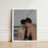 White-framed Art Print Two Shirtless Men Beach Rendered Gay Hookup, Surf Spits Foam, Faces Drift Nearer