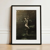 Nude Dancer with Aulos - Arnold Genthe Art Print / Canvas Black-framed Sepia-toned Photograph Woman Outdoor, Genthe’s, Left Knee Folds,