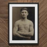 Portrait of a Tattooed American Soldier Art Print / Canvas Black Framed Sepia-toned Muscular Man Tattoos Faces Forward, Torso Unclothed,