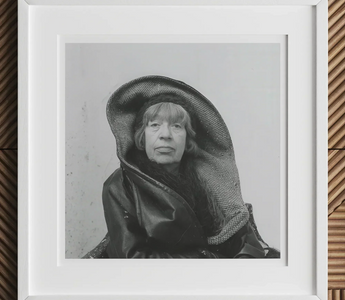 Black and white portrait of a person in large dark hood inspired by louise bourgeois and marina abramović rituals