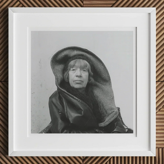 Black and white portrait of a person in large dark hood inspired by louise bourgeois and marina abramović rituals