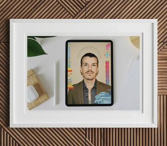 Tablet displaying a portrait of a man with mustache on colorful background for digital marketing agencies article