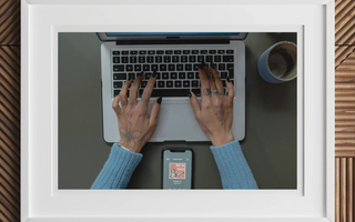 Laptop with hands typing on keyboard illustrating the creative process of australian theatre in not in print article