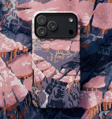 American Art Phone Cases showcasing a vibrant landscape with clouds and earth tones, surrounded by eclectic decorative objects.