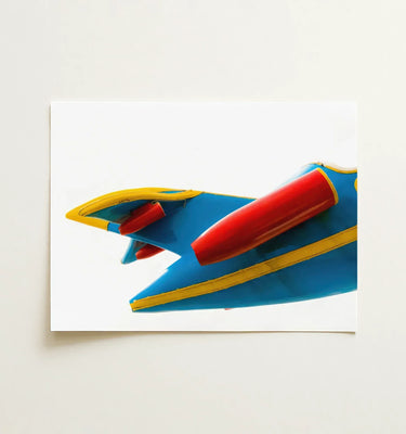 Vibrant depiction of a blue and red amusement park ride showcasing dynamic angles in Amusement Park Art.