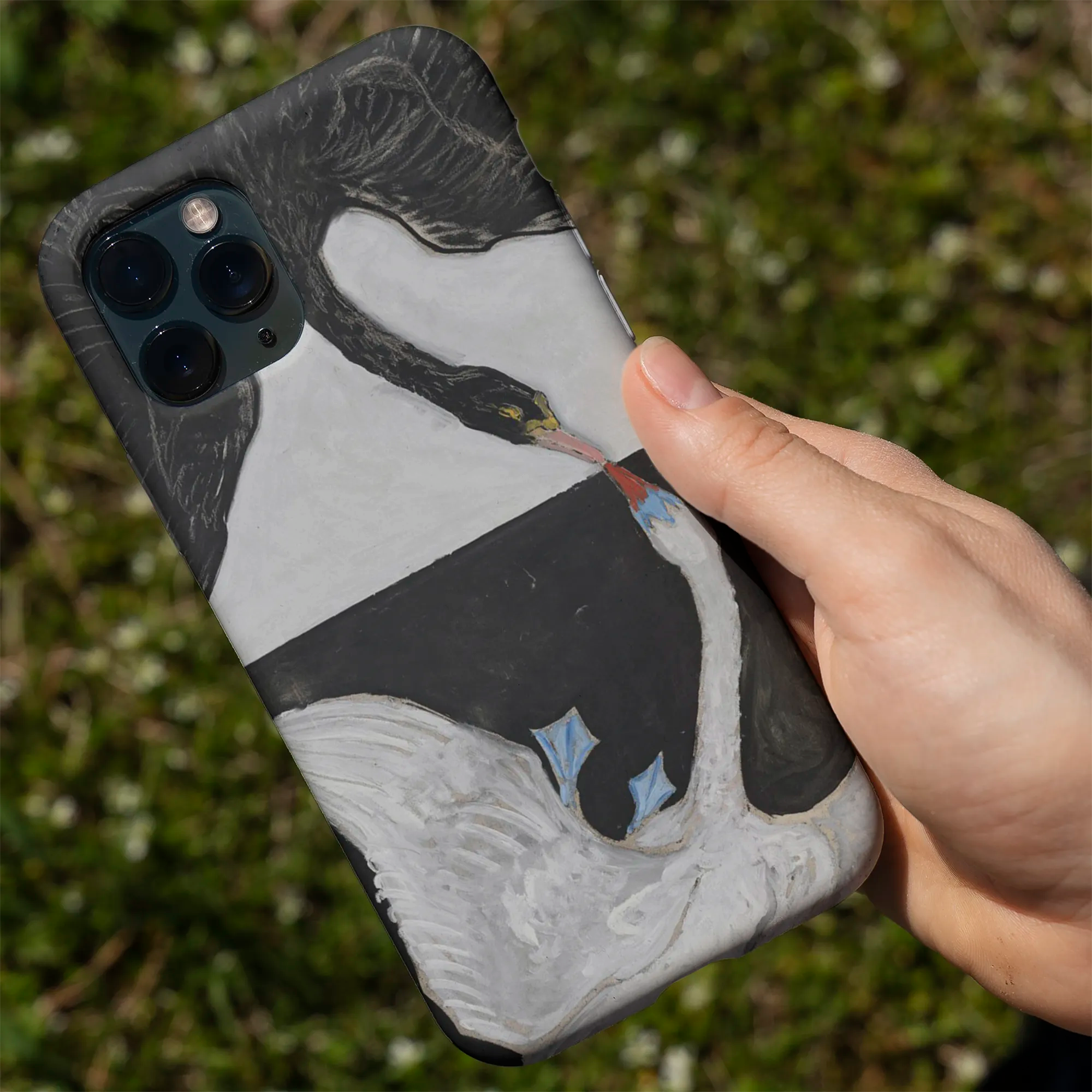 Decorative phone case featuring a nature-inspired design with a bird, butterfly, and floral elements.