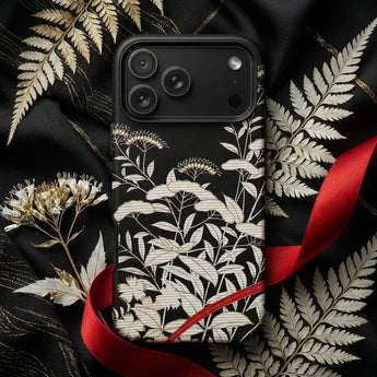Black and White Phone Cases featuring floral designs on a black background with decorative elements.
