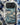 Blue Phone Cases featuring a wave design on a smartphone cover surrounded by artistic tools.