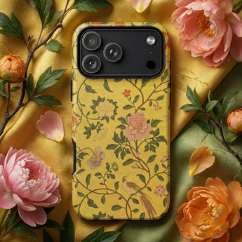 Colorful Phone Cases featuring a vibrant design with goldfish and lush plants on a decorative background.