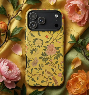 Colorful Phone Cases featuring a vibrant design with goldfish and lush plants on a decorative background.
